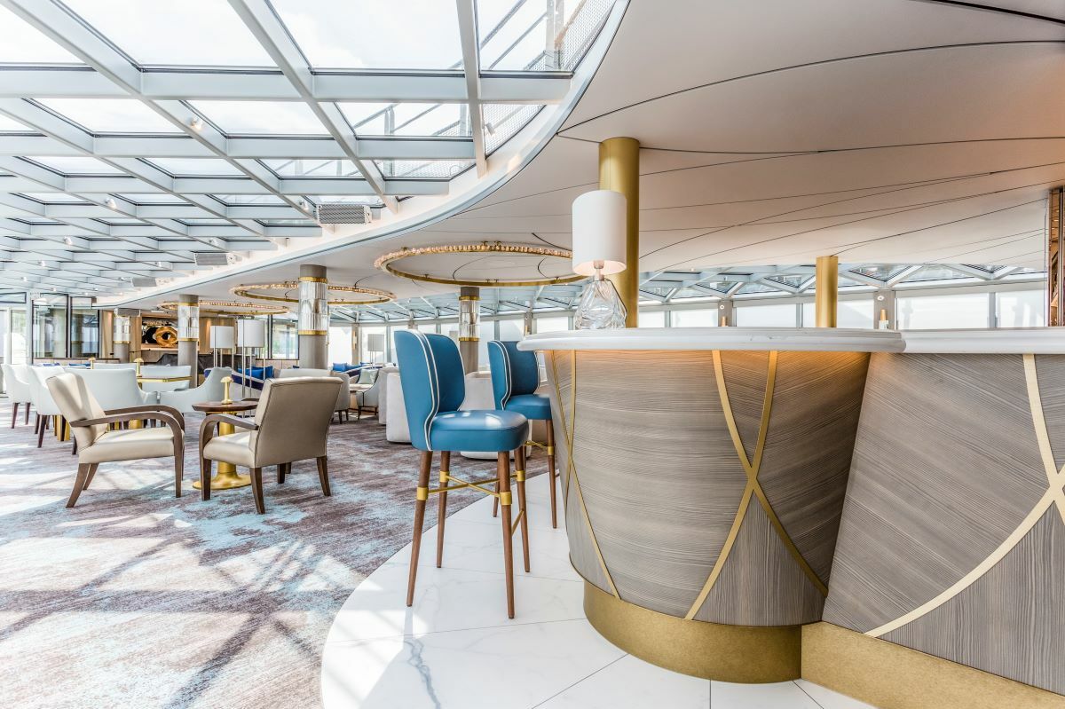 A plush lounge and bar onboard Riverside Debussy.
