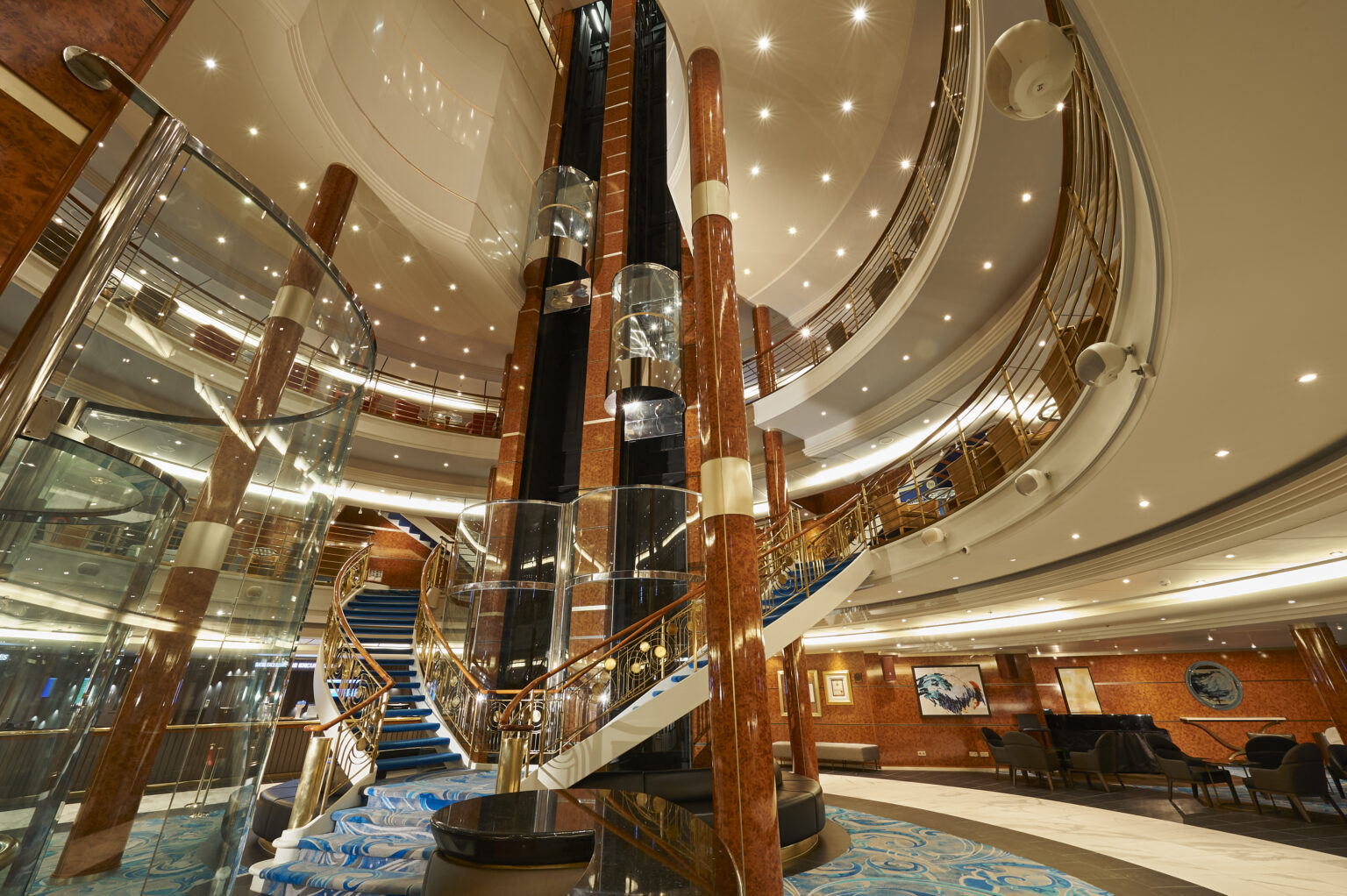 The atrium of the Norwegian Sun with staircase and elevator.